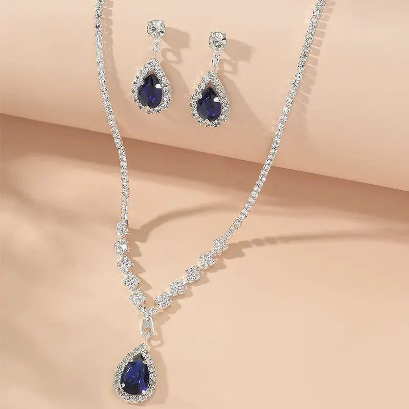 https://cdn.shopify.com/s/files/1/0820/4999/0943/files/shimmering-blue-teardrop-diamond-necklace-and-earrings-set-701205.webp?v=1722417089