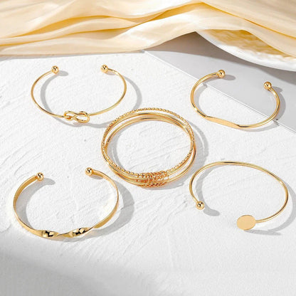 https://cdn.shopify.com/s/files/1/0820/4999/0943/files/5pcs-twist-bangle-bracelet-stack-267656.webp?v=1722168231