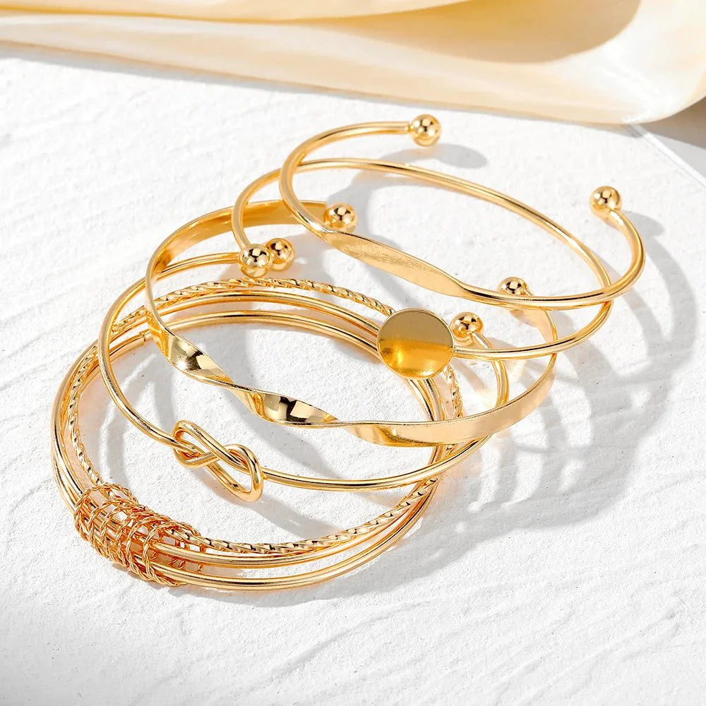 https://cdn.shopify.com/s/files/1/0820/4999/0943/files/5pcs-twist-bangle-bracelet-stack-301723.webp?v=1722168231