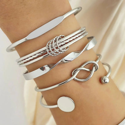 https://cdn.shopify.com/s/files/1/0820/4999/0943/files/5pcs-twist-bangle-bracelet-stack-320744.webp?v=1722168231