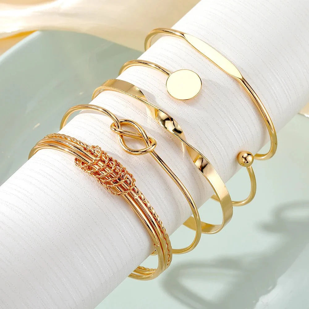 https://cdn.shopify.com/s/files/1/0820/4999/0943/files/5pcs-twist-bangle-bracelet-stack-704263.webp?v=1722168231