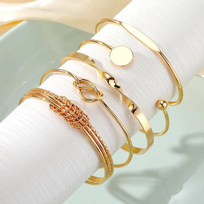 https://cdn.shopify.com/s/files/1/0820/4999/0943/files/5pcs-twist-bangle-bracelet-stack-704263.webp?v=1722168231
