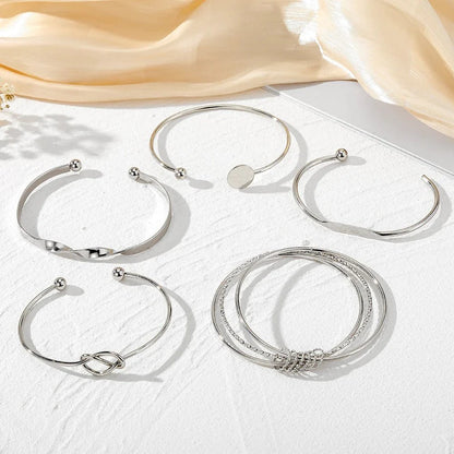 https://cdn.shopify.com/s/files/1/0820/4999/0943/files/5pcs-twist-bangle-bracelet-stack-713848.webp?v=1722168231