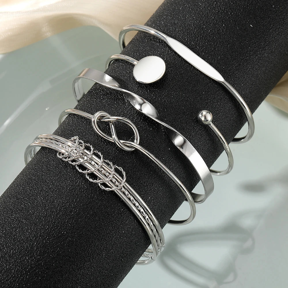 https://cdn.shopify.com/s/files/1/0820/4999/0943/files/5pcs-twist-bangle-bracelet-stack-730613.webp?v=1722168231
