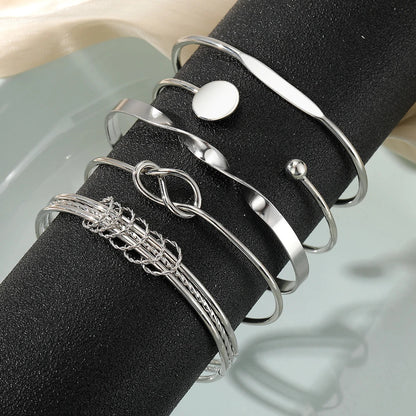 https://cdn.shopify.com/s/files/1/0820/4999/0943/files/5pcs-twist-bangle-bracelet-stack-730613.webp?v=1722168231