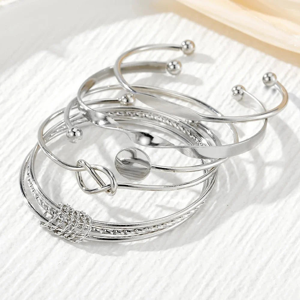 https://cdn.shopify.com/s/files/1/0820/4999/0943/files/5pcs-twist-bangle-bracelet-stack-984712.webp?v=1722168231