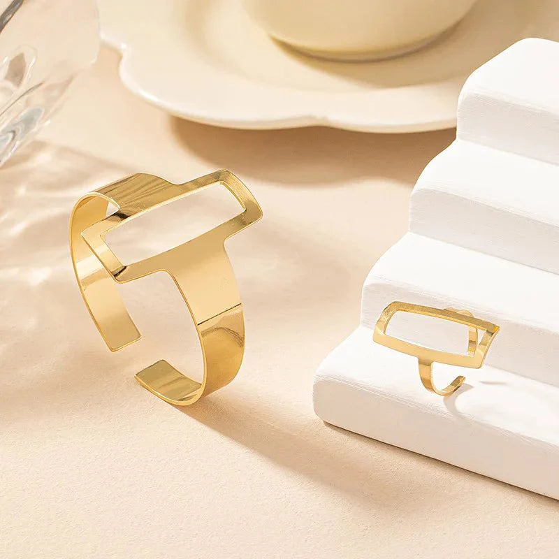 https://cdn.shopify.com/s/files/1/0820/4999/0943/files/adjustable-geometric-rectangle-bracelet-and-ring-set-225709.webp?v=1718190962