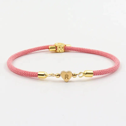 https://cdn.shopify.com/s/files/1/0820/4999/0943/files/adjustable-heart-letter-initial-bracelets-680157.webp?v=1720261937