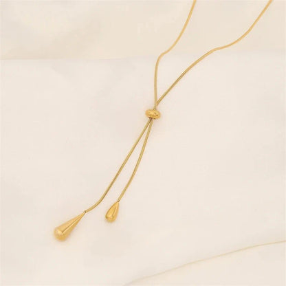https://cdn.shopify.com/s/files/1/0820/4999/0943/files/adjustable-pull-droplet-lariat-necklace-and-earrings-108081.webp?v=1720179727