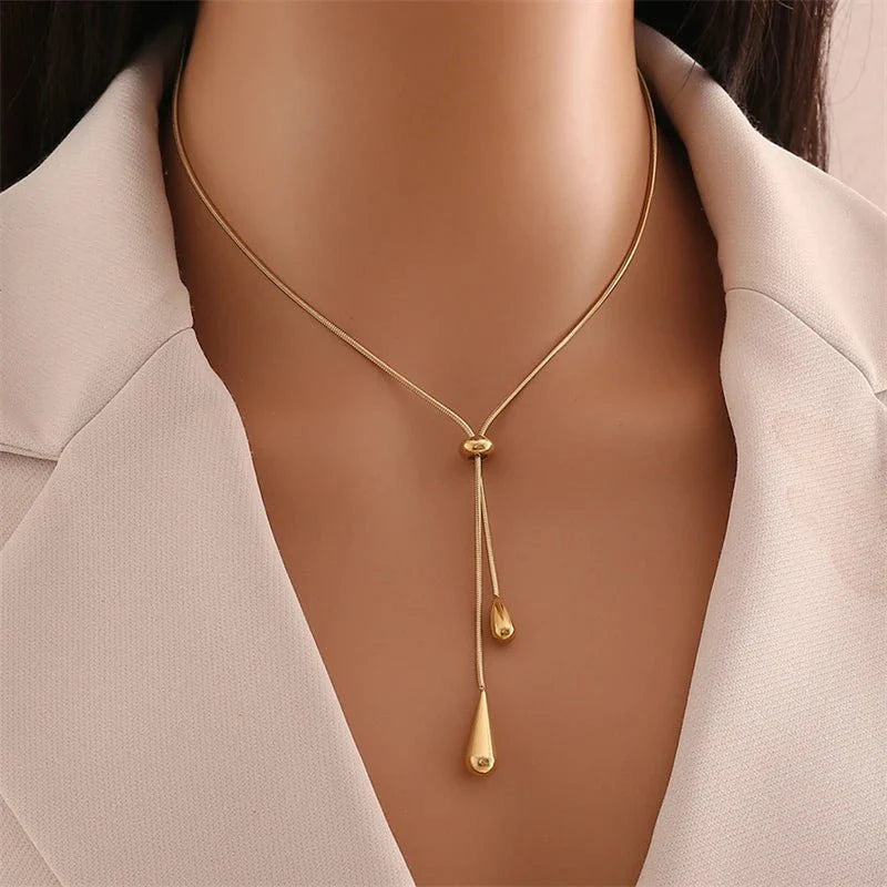 https://cdn.shopify.com/s/files/1/0820/4999/0943/files/adjustable-pull-droplet-lariat-necklace-and-earrings-122906.webp?v=1762198379