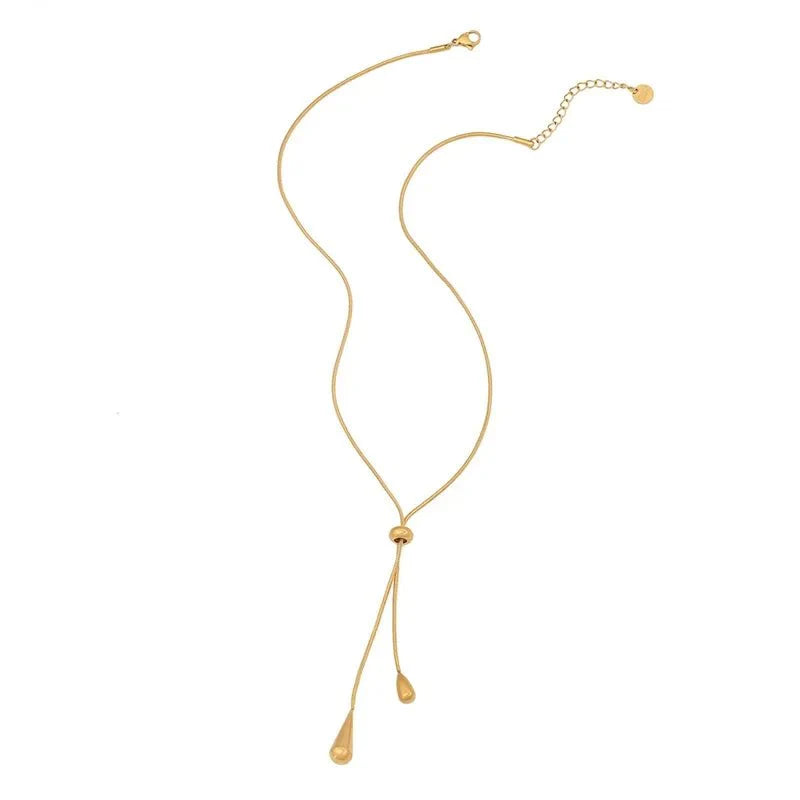 https://cdn.shopify.com/s/files/1/0820/4999/0943/files/adjustable-pull-droplet-lariat-necklace-and-earrings-915653.webp?v=1720179727