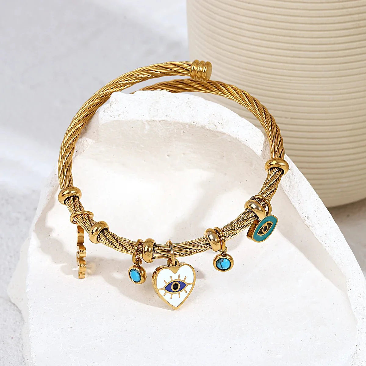 https://cdn.shopify.com/s/files/1/0820/4999/0943/files/boho-evil-eye-rope-bangle-bracelet-158058.webp?v=1718605382