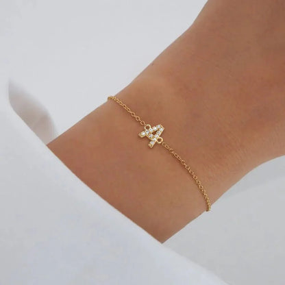 https://cdn.shopify.com/s/files/1/0820/4999/0943/files/dainty-initial-chain-bracelet-125212.webp?v=1723746987