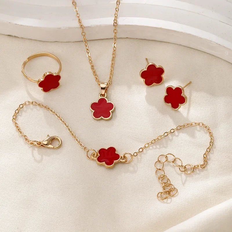 https://cdn.shopify.com/s/files/1/0820/4999/0943/files/dainty-lucky-floral-clover-necklace-bracelet-earrings-and-rings-set-142594.webp?v=1721505599
