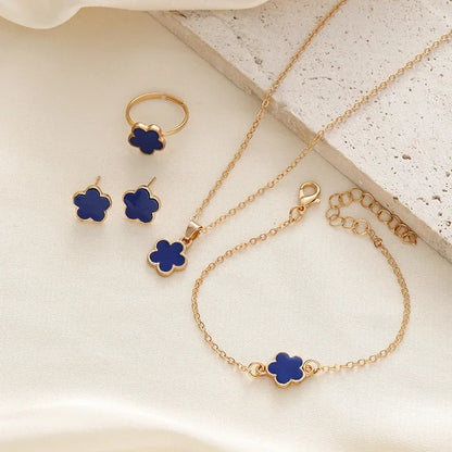 https://cdn.shopify.com/s/files/1/0820/4999/0943/files/dainty-lucky-floral-clover-necklace-bracelet-earrings-and-rings-set-382509.webp?v=1721505599
