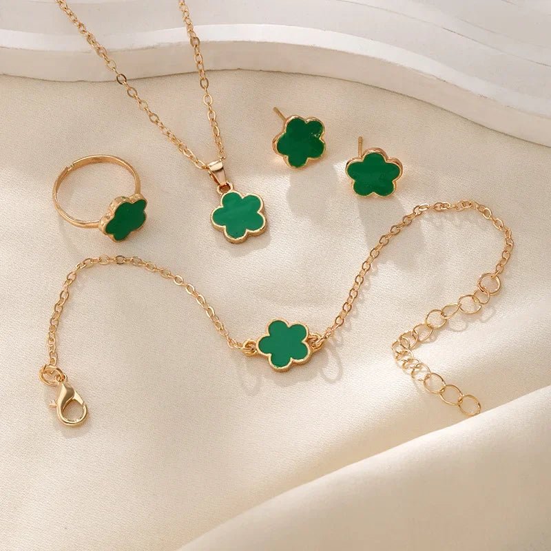 https://cdn.shopify.com/s/files/1/0820/4999/0943/files/dainty-lucky-floral-clover-necklace-bracelet-earrings-and-rings-set-550905.webp?v=1721505599