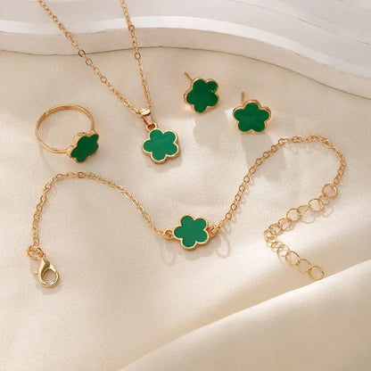 https://cdn.shopify.com/s/files/1/0820/4999/0943/files/dainty-lucky-floral-clover-necklace-bracelet-earrings-and-rings-set-550905.webp?v=1721505599