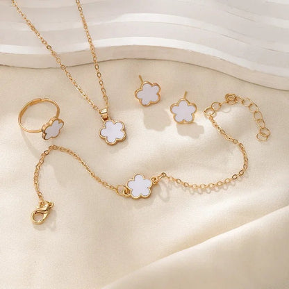 https://cdn.shopify.com/s/files/1/0820/4999/0943/files/dainty-lucky-floral-clover-necklace-bracelet-earrings-and-rings-set-659885.webp?v=1721505599