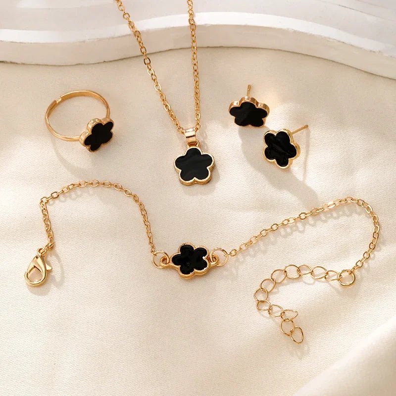 https://cdn.shopify.com/s/files/1/0820/4999/0943/files/dainty-lucky-floral-clover-necklace-bracelet-earrings-and-rings-set-980733.webp?v=1721505599