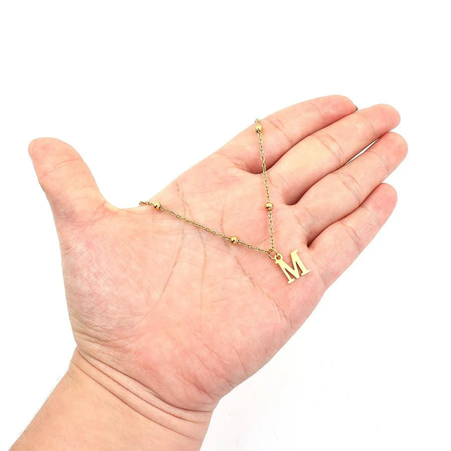 https://cdn.shopify.com/s/files/1/0820/4999/0943/files/dainty-satellite-chain-letter-initial-necklace-128686.webp?v=1724406192