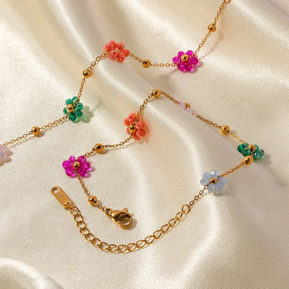 https://cdn.shopify.com/s/files/1/0820/4999/0943/files/dainty-spring-floral-bracelet-and-necklace-231274.jpg?v=1712675939