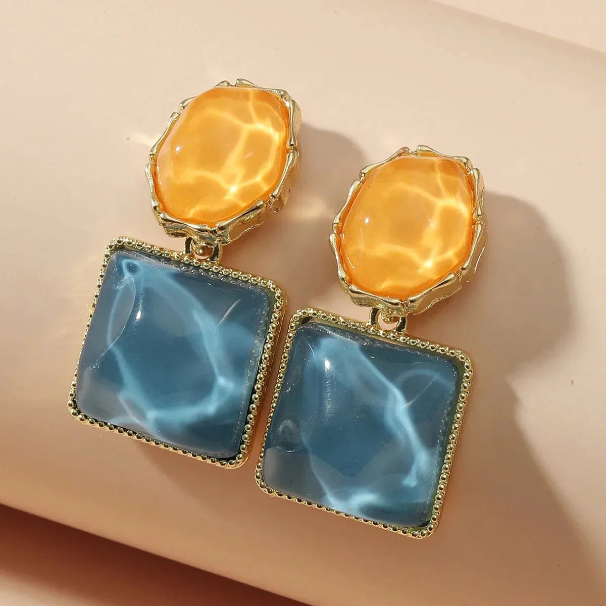 https://cdn.shopify.com/s/files/1/0820/4999/0943/files/enamel-geometric-oval-square-earrings-214400.webp?v=1720262703