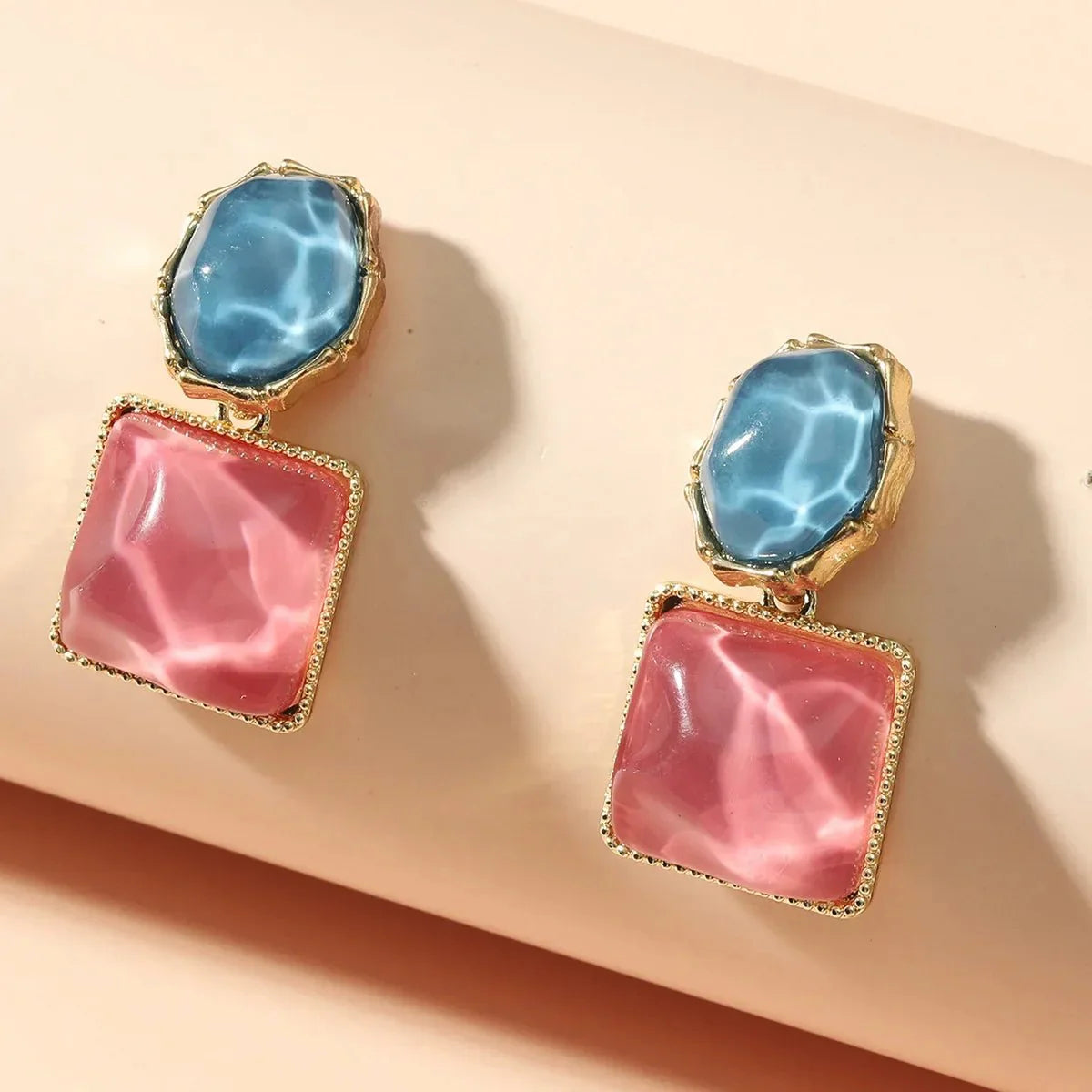 https://cdn.shopify.com/s/files/1/0820/4999/0943/files/enamel-geometric-oval-square-earrings-238597.webp?v=1720262703