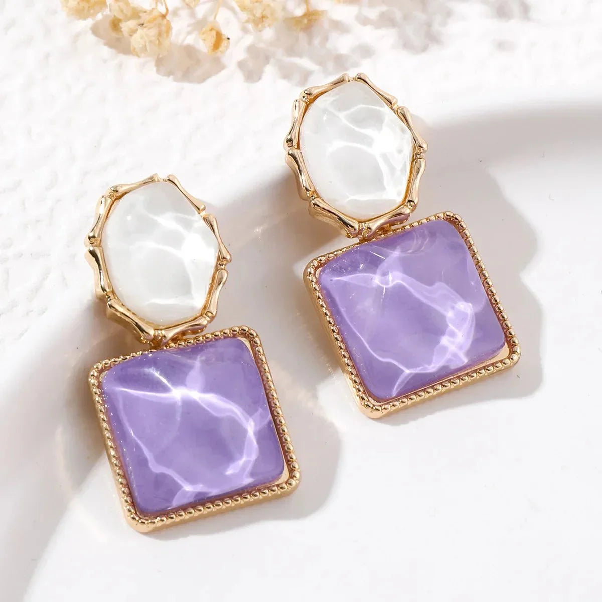 https://cdn.shopify.com/s/files/1/0820/4999/0943/files/enamel-geometric-oval-square-earrings-366051.webp?v=1720262703