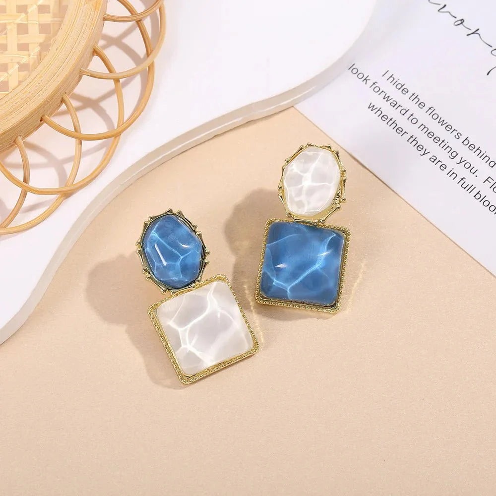 https://cdn.shopify.com/s/files/1/0820/4999/0943/files/enamel-geometric-oval-square-earrings-390408.webp?v=1720262703