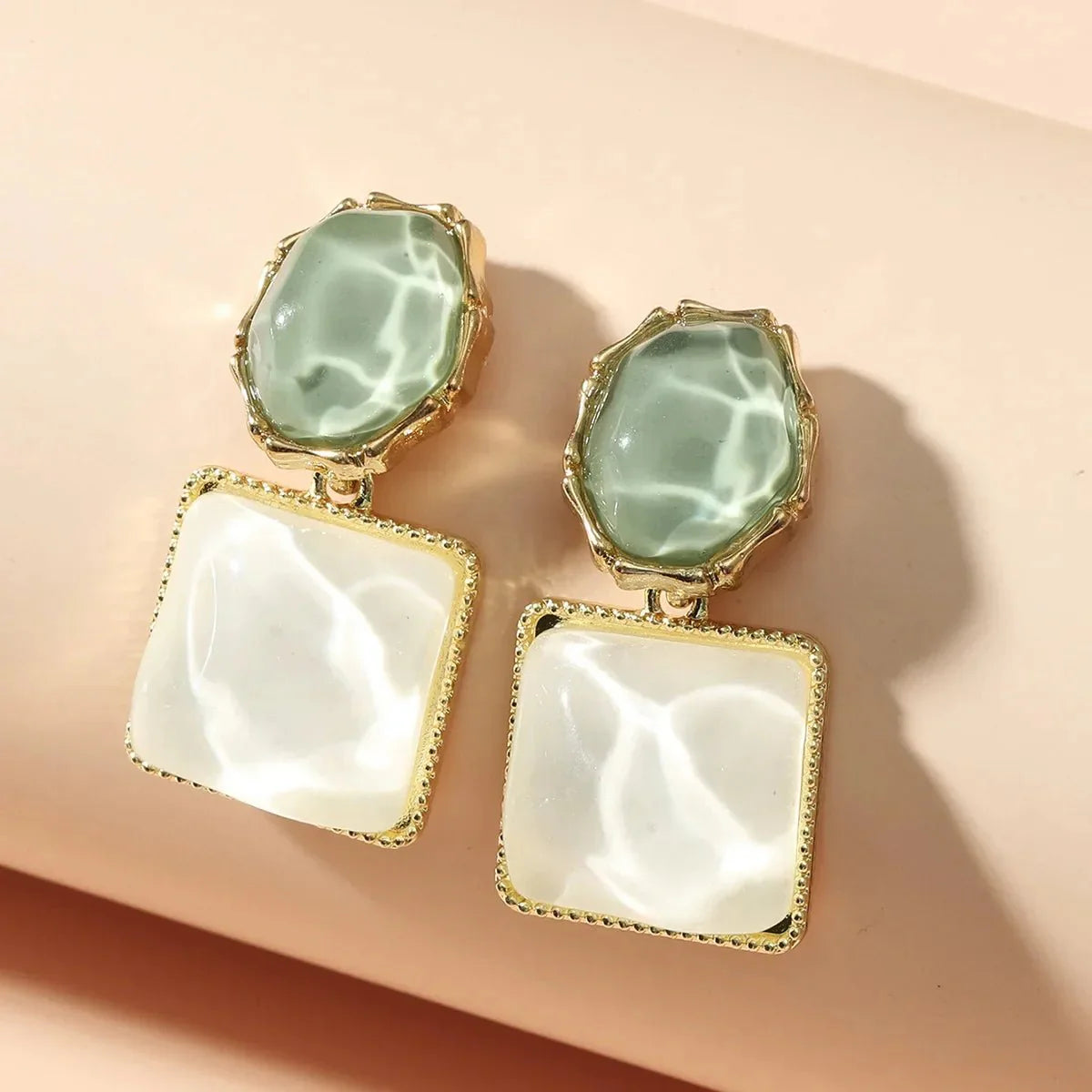 https://cdn.shopify.com/s/files/1/0820/4999/0943/files/enamel-geometric-oval-square-earrings-568771.webp?v=1720262703