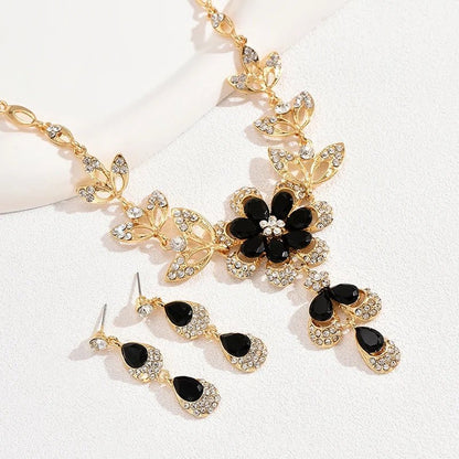 https://cdn.shopify.com/s/files/1/0820/4999/0943/files/floral-black-and-gold-diamond-necklace-and-earring-set-441409.jpg?v=1718191087