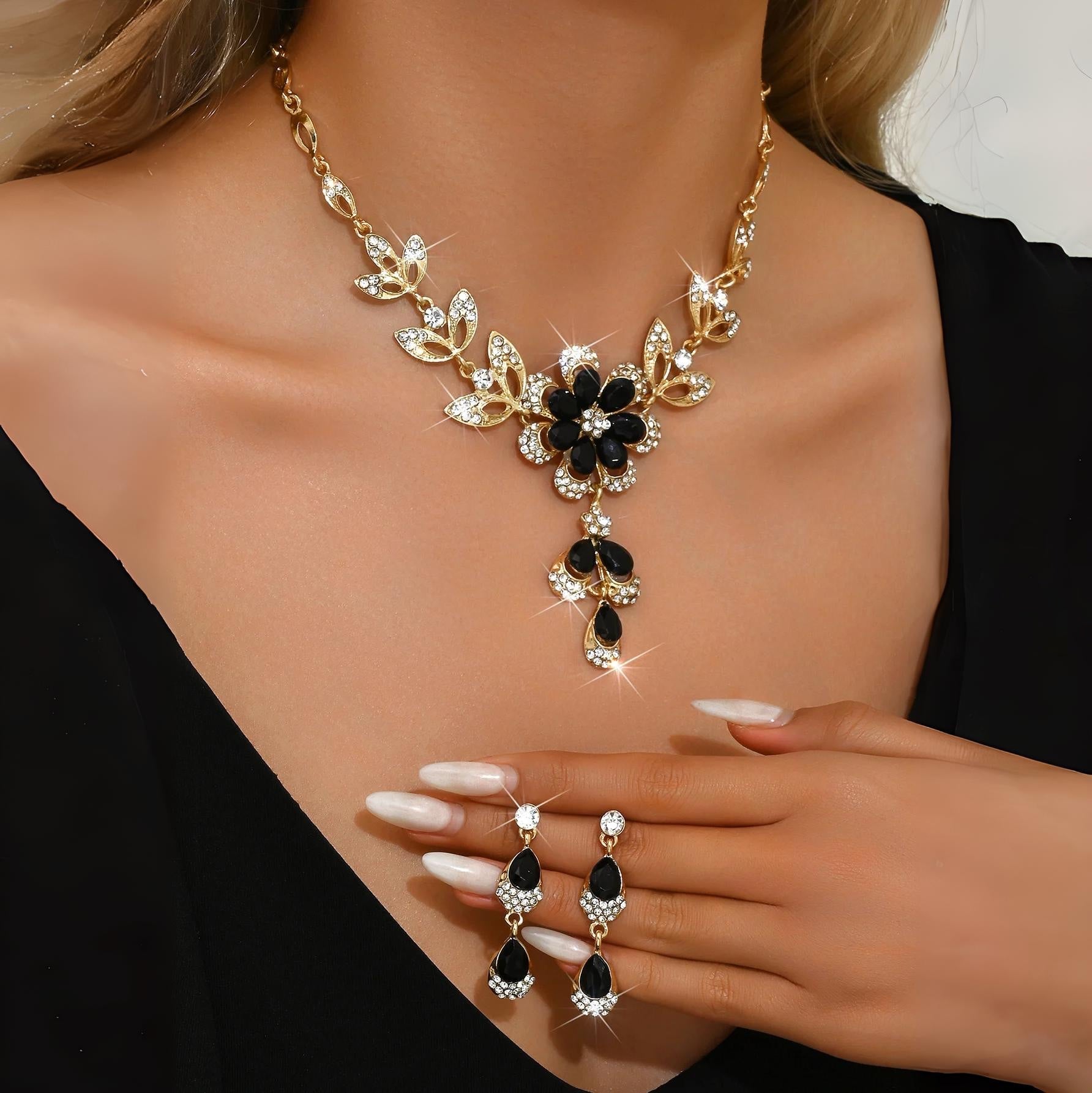 https://cdn.shopify.com/s/files/1/0820/4999/0943/files/floral-black-and-gold-diamond-necklace-and-earring-set-541136.jpg?v=1718191087