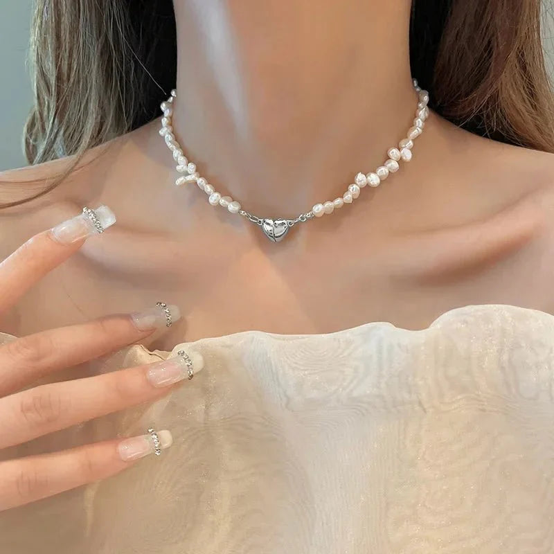 https://cdn.shopify.com/s/files/1/0820/4999/0943/files/magnetic-heart-pearl-choker-necklace-and-bracelet-480431.webp?v=1714833767