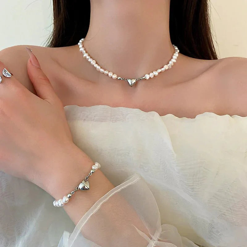 https://cdn.shopify.com/s/files/1/0820/4999/0943/files/magnetic-heart-pearl-choker-necklace-and-bracelet-909502.webp?v=1762198032
