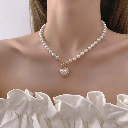 https://cdn.shopify.com/s/files/1/0820/4999/0943/files/pearl-heart-clasp-choker-necklace-606959.webp?v=1762198014