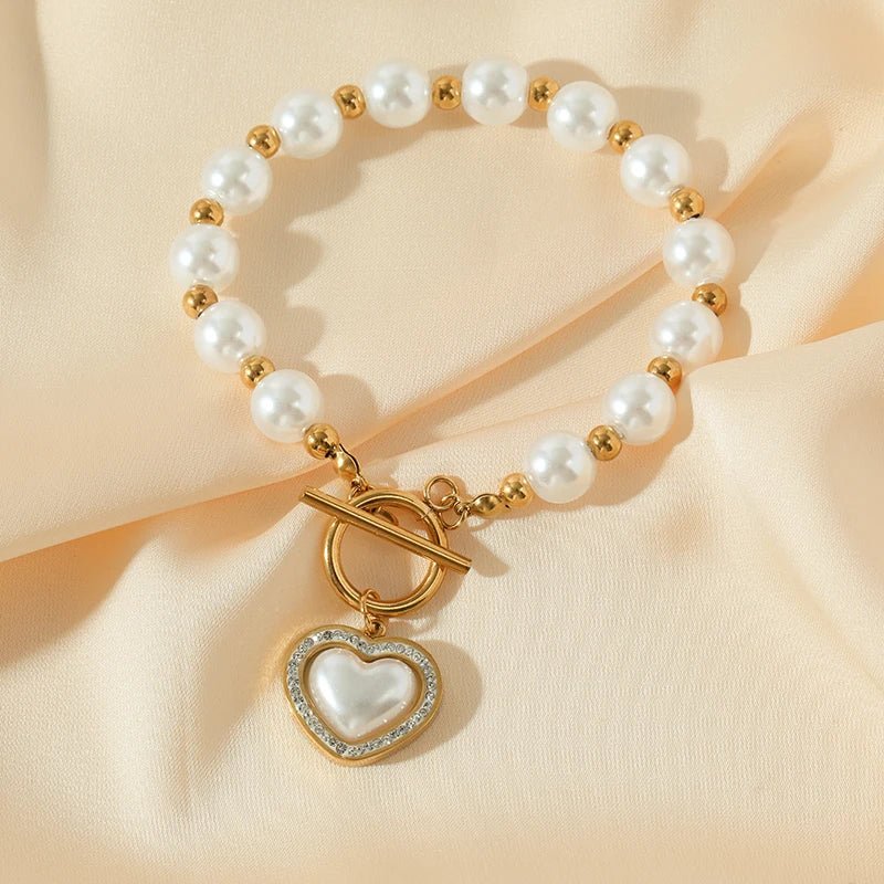 https://cdn.shopify.com/s/files/1/0820/4999/0943/files/pearl-heart-clasp-choker-necklace-891849.jpg?v=1715496532