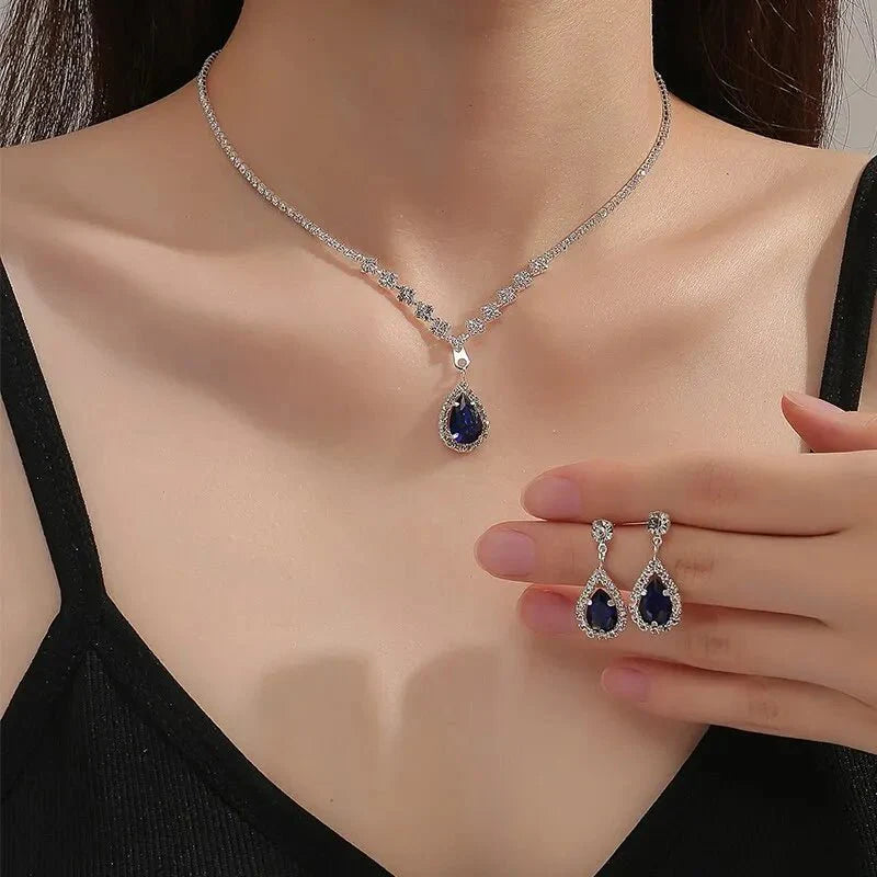 https://cdn.shopify.com/s/files/1/0820/4999/0943/files/shimmering-blue-teardrop-diamond-necklace-and-earrings-set-780787.webp?v=1762198482