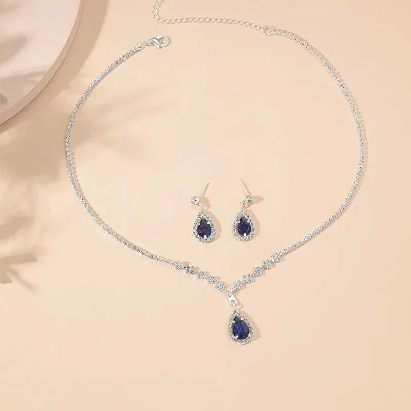https://cdn.shopify.com/s/files/1/0820/4999/0943/files/shimmering-blue-teardrop-diamond-necklace-and-earrings-set-819263.webp?v=1722417089