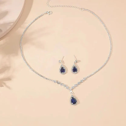 https://cdn.shopify.com/s/files/1/0820/4999/0943/files/shimmering-blue-teardrop-diamond-necklace-and-earrings-set-819263.webp?v=1722417089