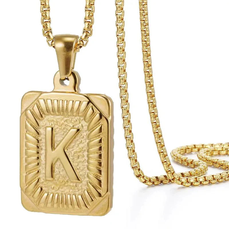 https://cdn.shopify.com/s/files/1/0820/4999/0943/files/textured-rectangle-letter-initial-necklace-223084.webp?v=1724157553