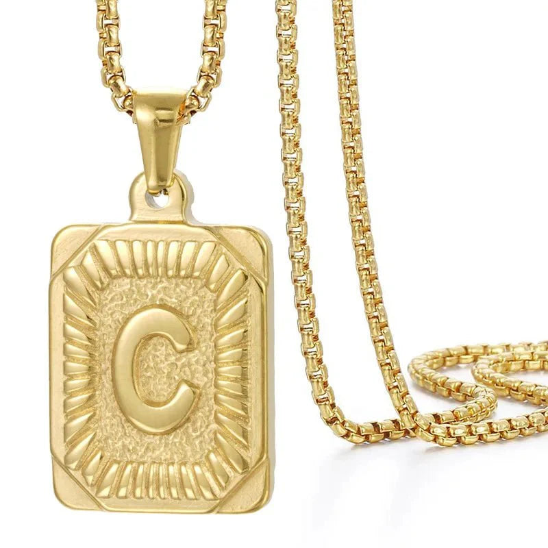 https://cdn.shopify.com/s/files/1/0820/4999/0943/files/textured-rectangle-letter-initial-necklace-358686.webp?v=1724157553