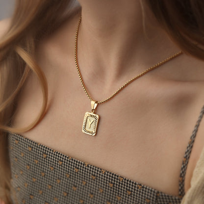 https://cdn.shopify.com/s/files/1/0820/4999/0943/files/textured-rectangle-letter-initial-necklace-388513.jpg?v=1762198552
