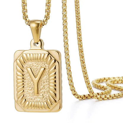 https://cdn.shopify.com/s/files/1/0820/4999/0943/files/textured-rectangle-letter-initial-necklace-554847.webp?v=1724157554
