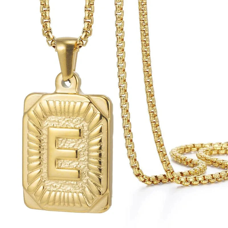 https://cdn.shopify.com/s/files/1/0820/4999/0943/files/textured-rectangle-letter-initial-necklace-595787.webp?v=1724157553