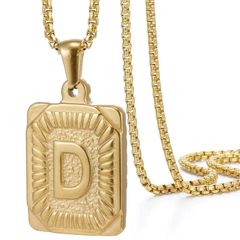 https://cdn.shopify.com/s/files/1/0820/4999/0943/files/textured-rectangle-letter-initial-necklace-660324.webp?v=1724157553