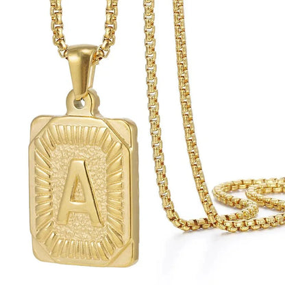 https://cdn.shopify.com/s/files/1/0820/4999/0943/files/textured-rectangle-letter-initial-necklace-704441.webp?v=1724157553