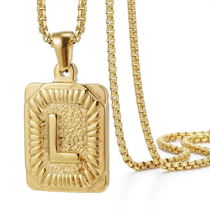 https://cdn.shopify.com/s/files/1/0820/4999/0943/files/textured-rectangle-letter-initial-necklace-799596.webp?v=1724157553